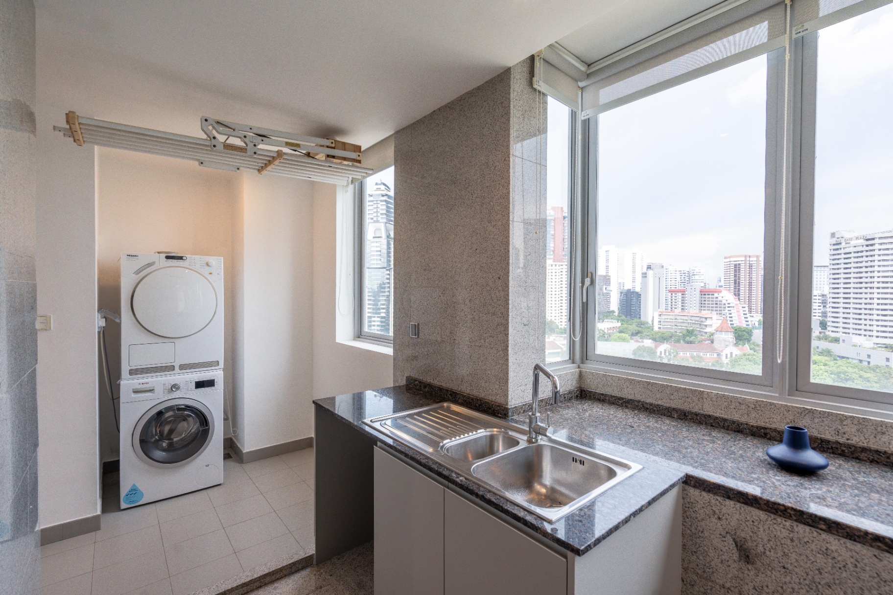 Draycott 8 — utility yard with Miele washer-dryer and secondary sink