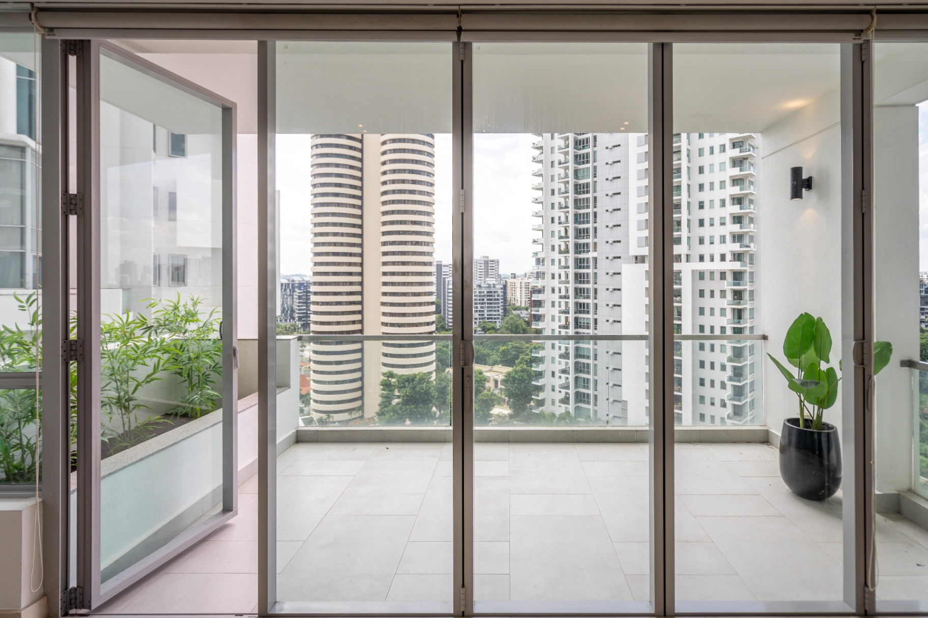 Draycott 8 — full-height balcony sliding doors opening to skyline view
