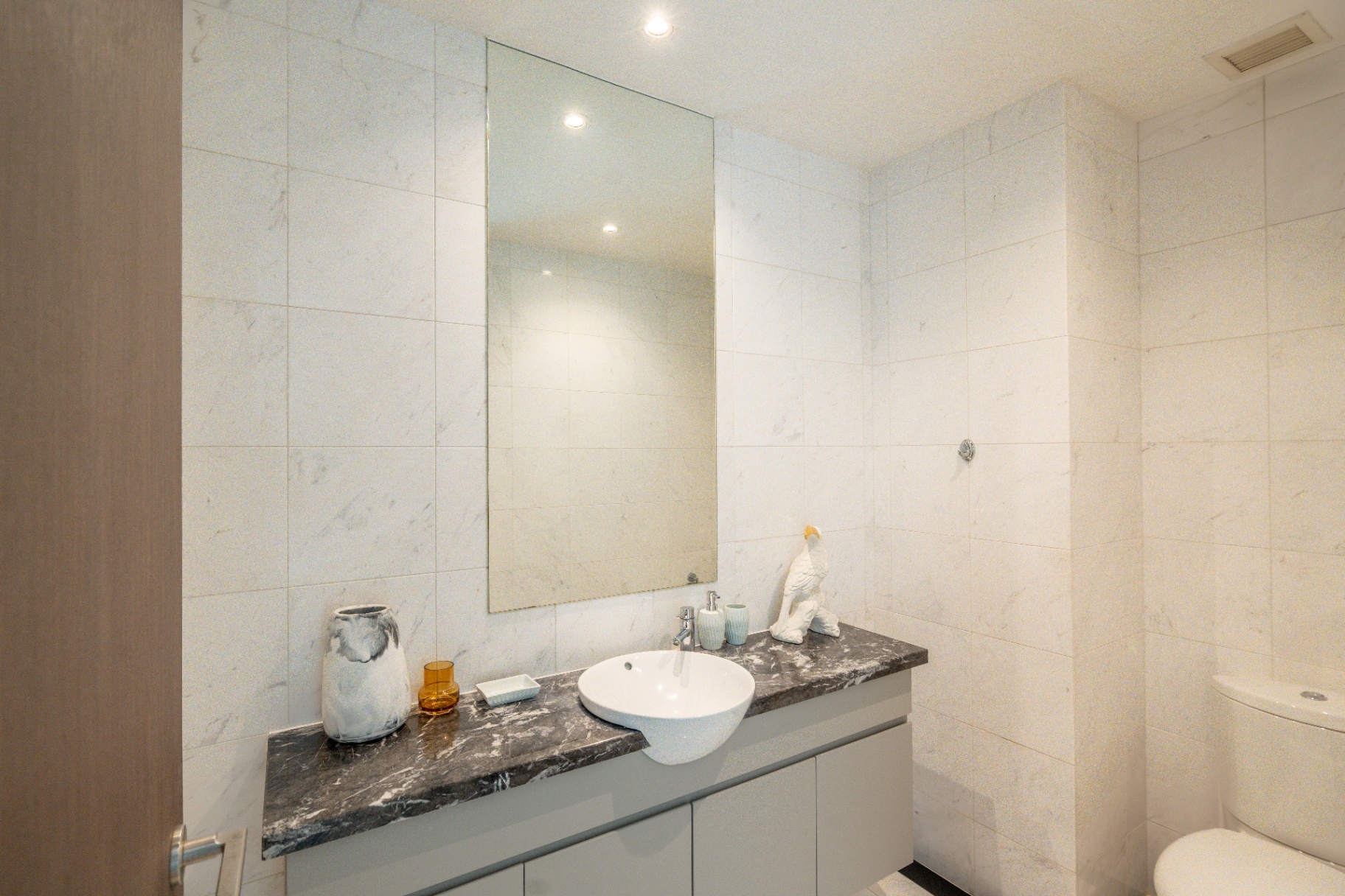 Draycott 8 — powder room with marble walls and stone vanity